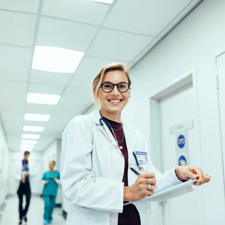 Locum tenens physician smiling while working in the hospital