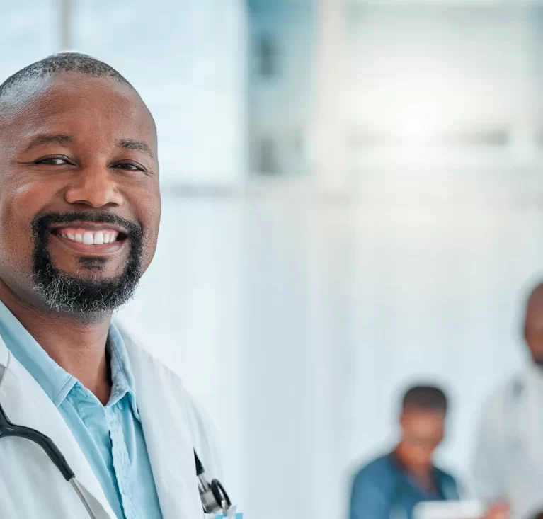 Locum tenens physician working at a hospital and smiling