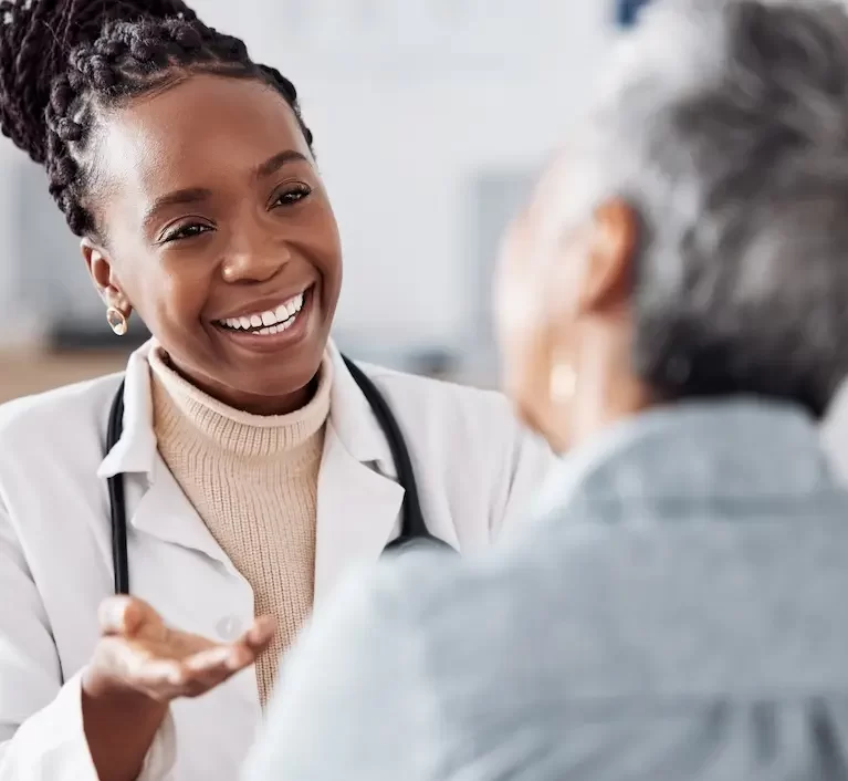 Locum tenens physician talking to a patient while in a doctor's office