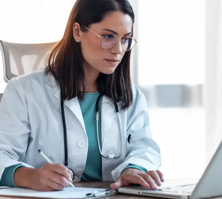 Locum tenens physician looking up and making a list about licensing and certification across different states